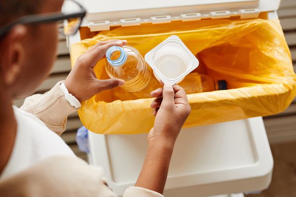 Boy Sorting Plastic at Home Top View